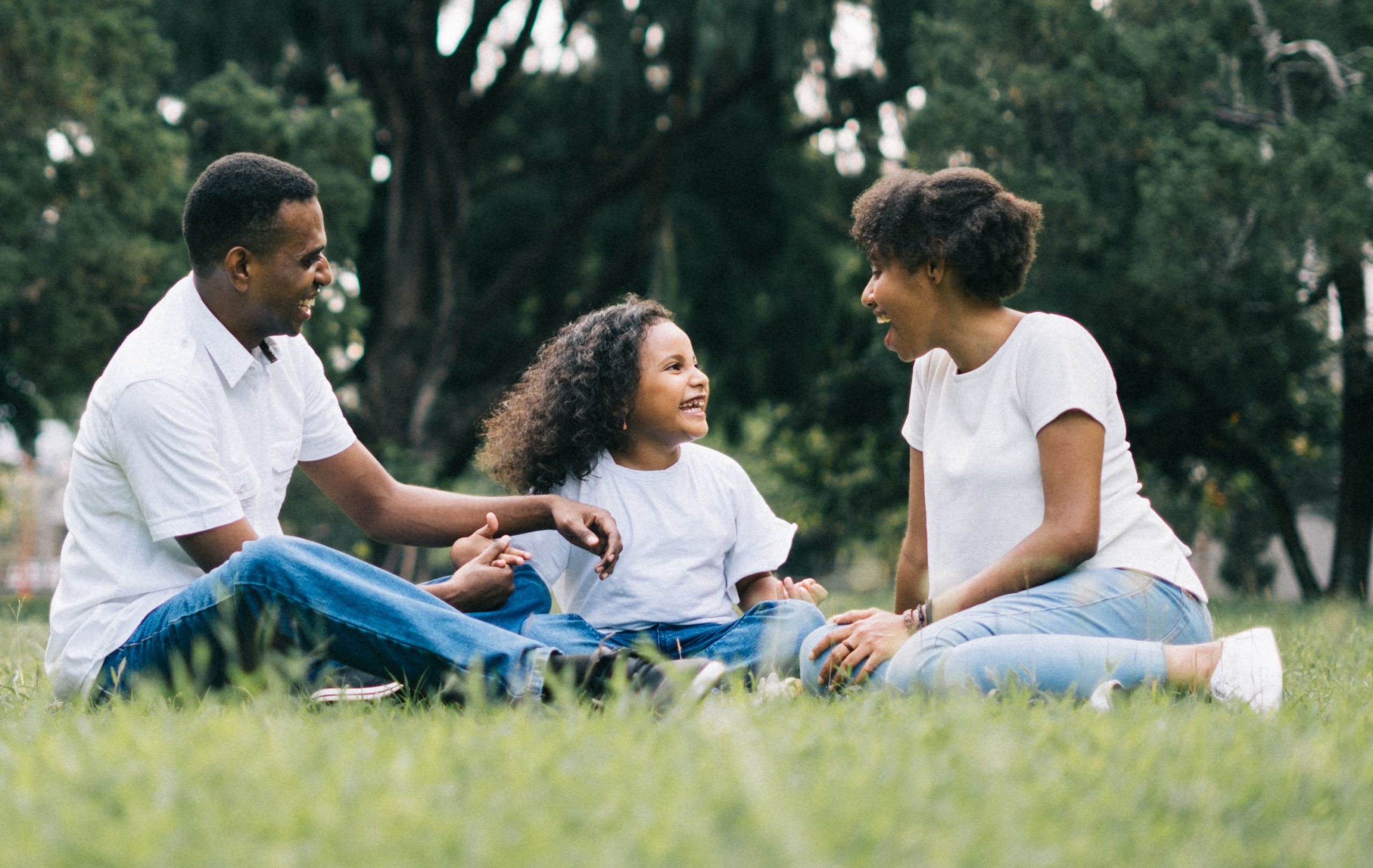 Family of Four at Home in Front Yard